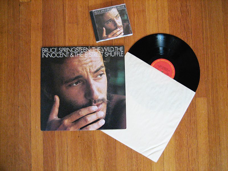 An LP and a CD of a Bruce Springsteen album (‘The Wild, The Innocent & The E Street Shuffle’)