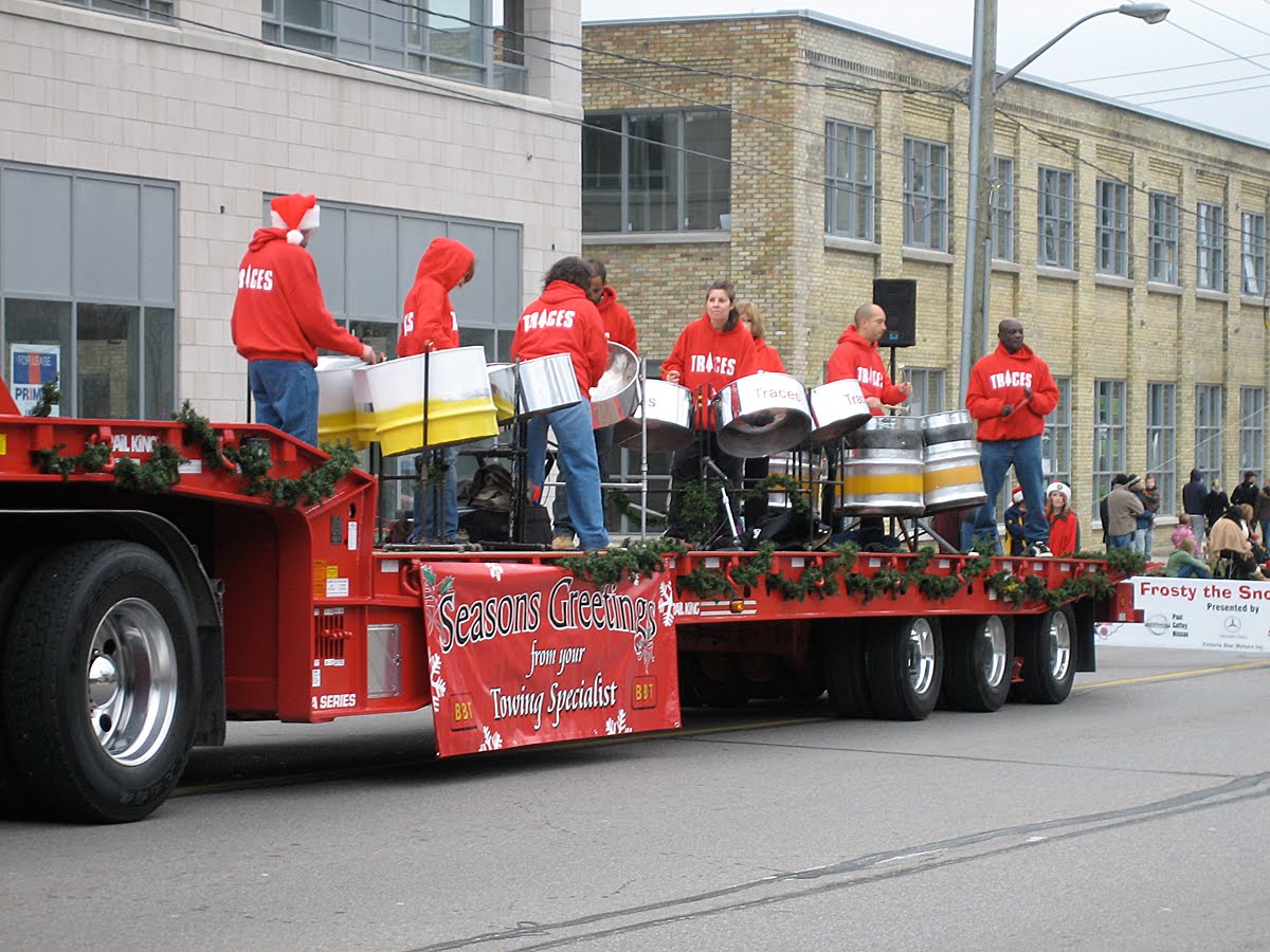 Steel pan musicians on a flatbed truck at the Santa Claus Parade