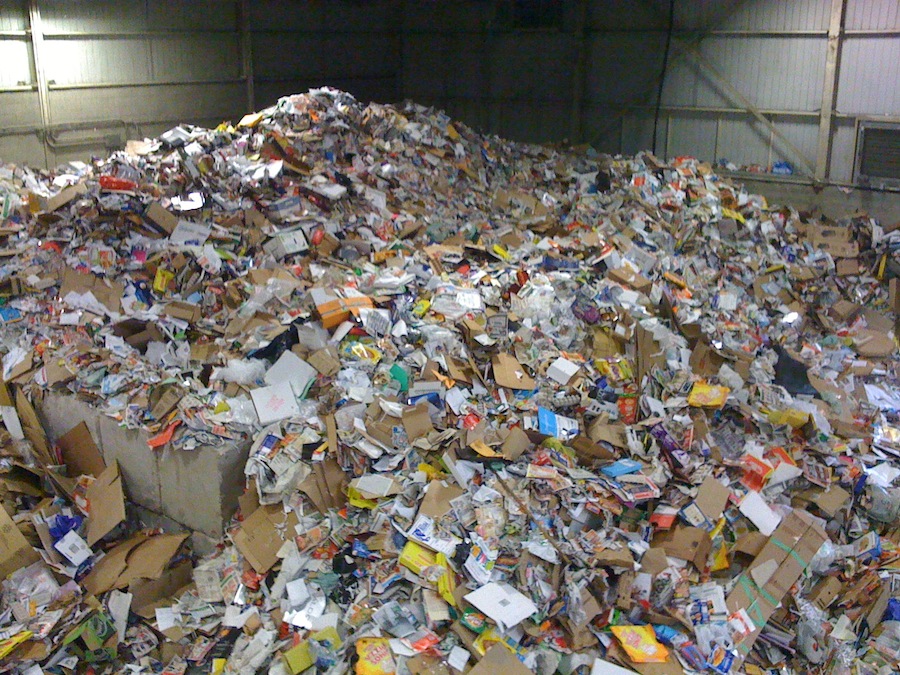 An enourmous pile of cardboard at recyling facility