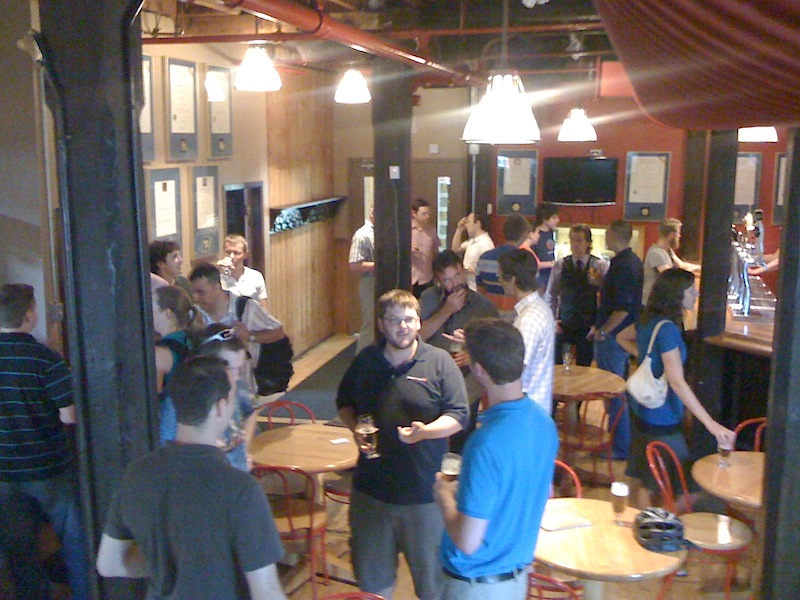 A group of people enjoying UX conversations and Beer at Brick Brewing