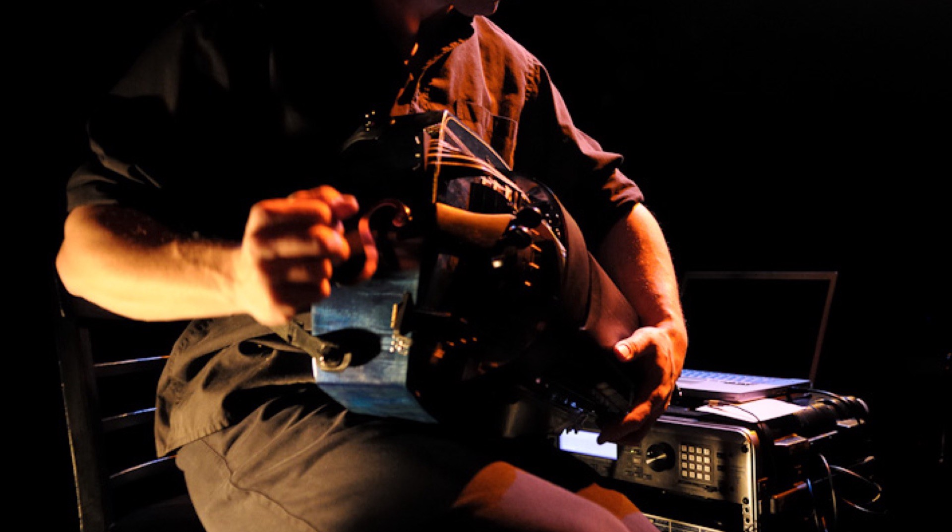 A musician performs on a hurdy gurdy